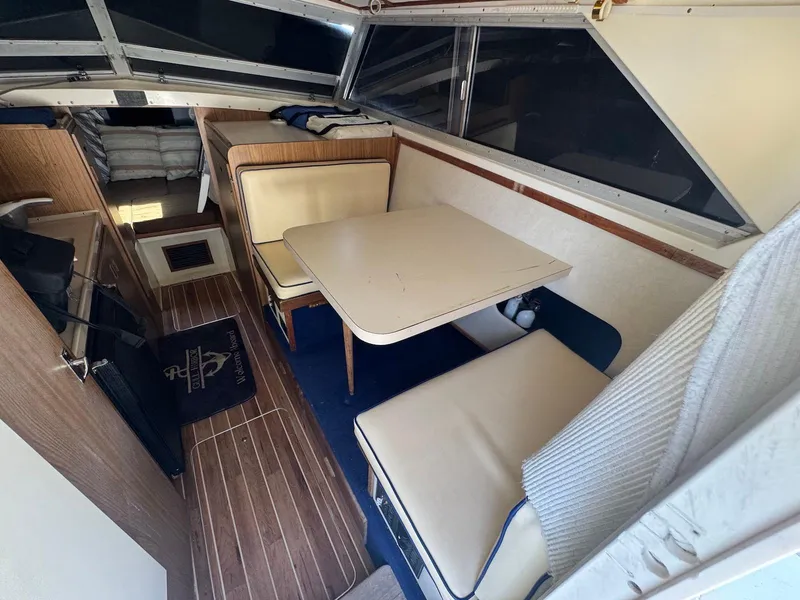 Slide: The Image of Interior of a 1973 Bertram 28 Sport Fisherman with seating and table. - 18