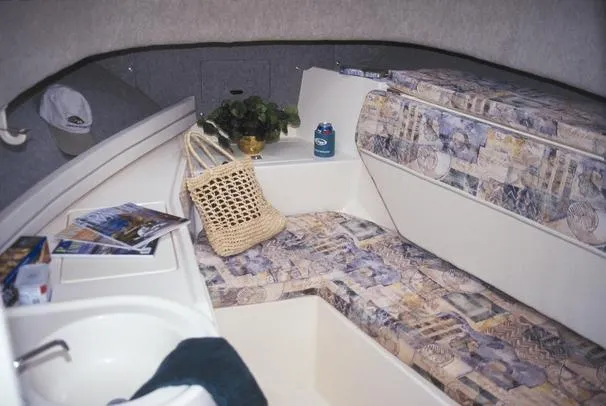 Slide: The Image of 2001 Grady-White Gulfstream 232 cabin interior with patterned seating, sink, and accessories. - 3