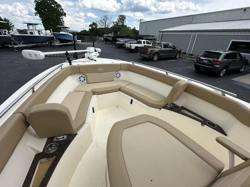 Slide: The Image of 2019 Scout 235 XSF boat interior with beige seating and modern design. - 11