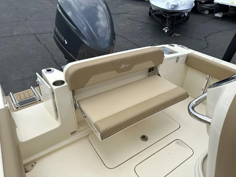 Slide: The Image of 2019 Scout 235 XSF boat with beige seating and Yamaha outboard motor. - 9