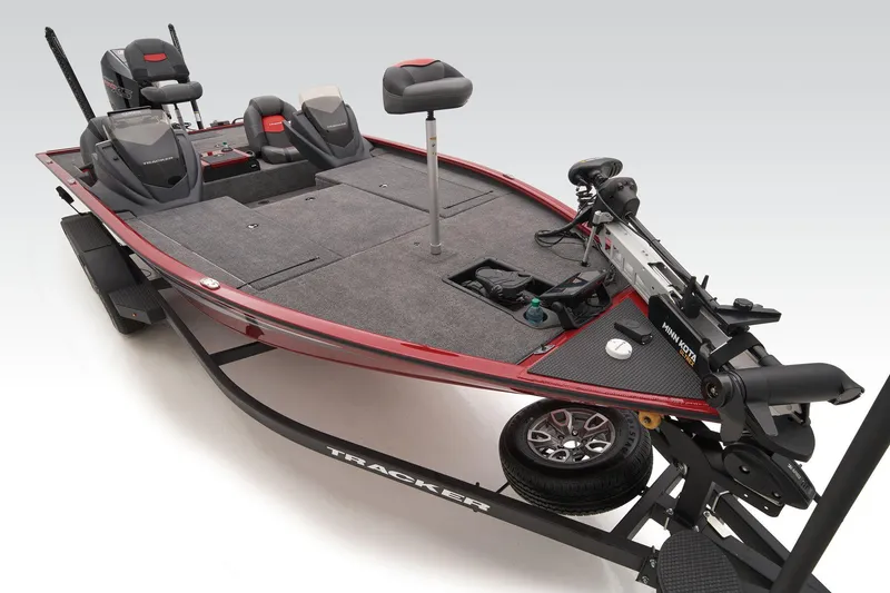 Slide: The Image of 2025 Tracker Savage 215 fishing boat with modern seating and equipment on a trailer. - 23
