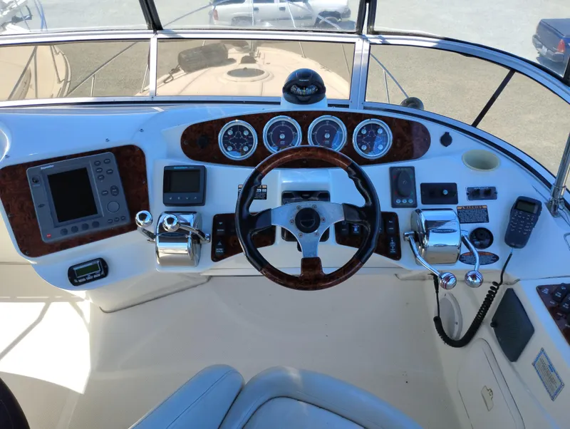 Slide: The Image of Helm of 2006 Meridian 341 Sedan with steering wheel, gauges, and navigation equipment. - 11