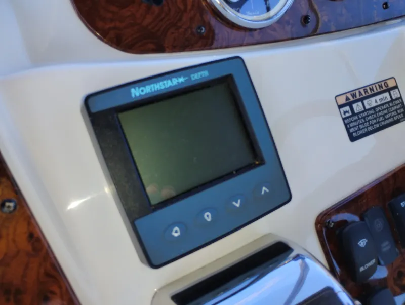 Slide: The Image of Northstar display on 2006 Meridian 341 Sedan dashboard with wood paneling. - 12