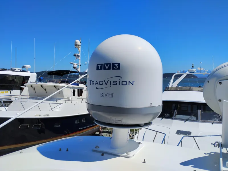 Slide: The Image of Satellite dish on 2006 Meridian 341 Sedan yacht, featuring TracVision technology, docked in marina. - 18