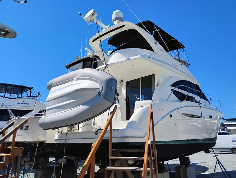 Slide: The Image of 2006 Meridian 341 Sedan yacht on display with inflatable boat attached. - 3