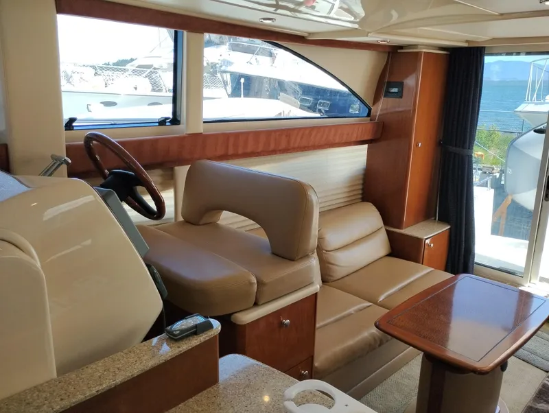 Slide: The Image of Interior of 2006 Meridian 341 Sedan yacht with leather seating and wooden accents. - 34