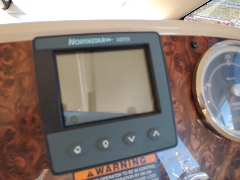 Slide: The Image of Northstar display on 2006 Meridian 341 Sedan dashboard with wood paneling. - 40