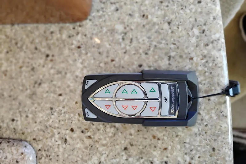 Slide: The Image of Remote control for 2006 Meridian 341 Sedan on a speckled countertop. - 42