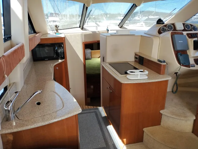 Slide: The Image of Interior of 2006 Meridian 341 Sedan yacht with kitchen and helm. - 44