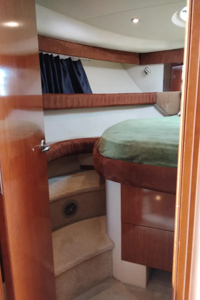 Slide: The Image of 2006 Meridian 341 Sedan cabin interior with wood finish and cozy bed. - 45