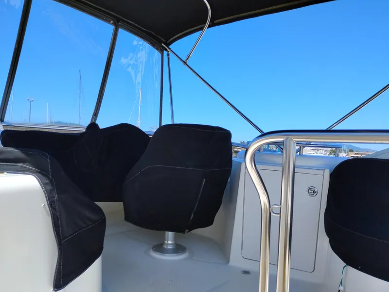 Slide: The Image of 2006 Meridian 341 Sedan interior with covered seats and clear blue sky. - 6