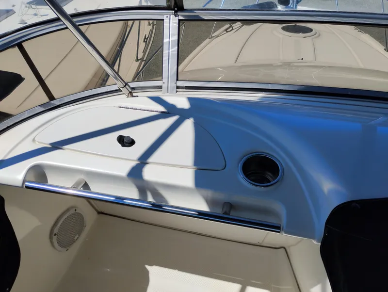 Slide: The Image of 2006 Meridian 341 Sedan boat interior with dashboard and cup holder. - 9