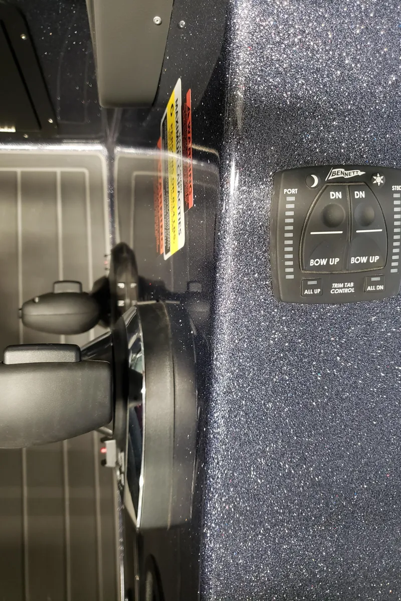 Slide: The Image of Control panel of 2024 Warrior 208 boat with navigation and adjustment features. - 10