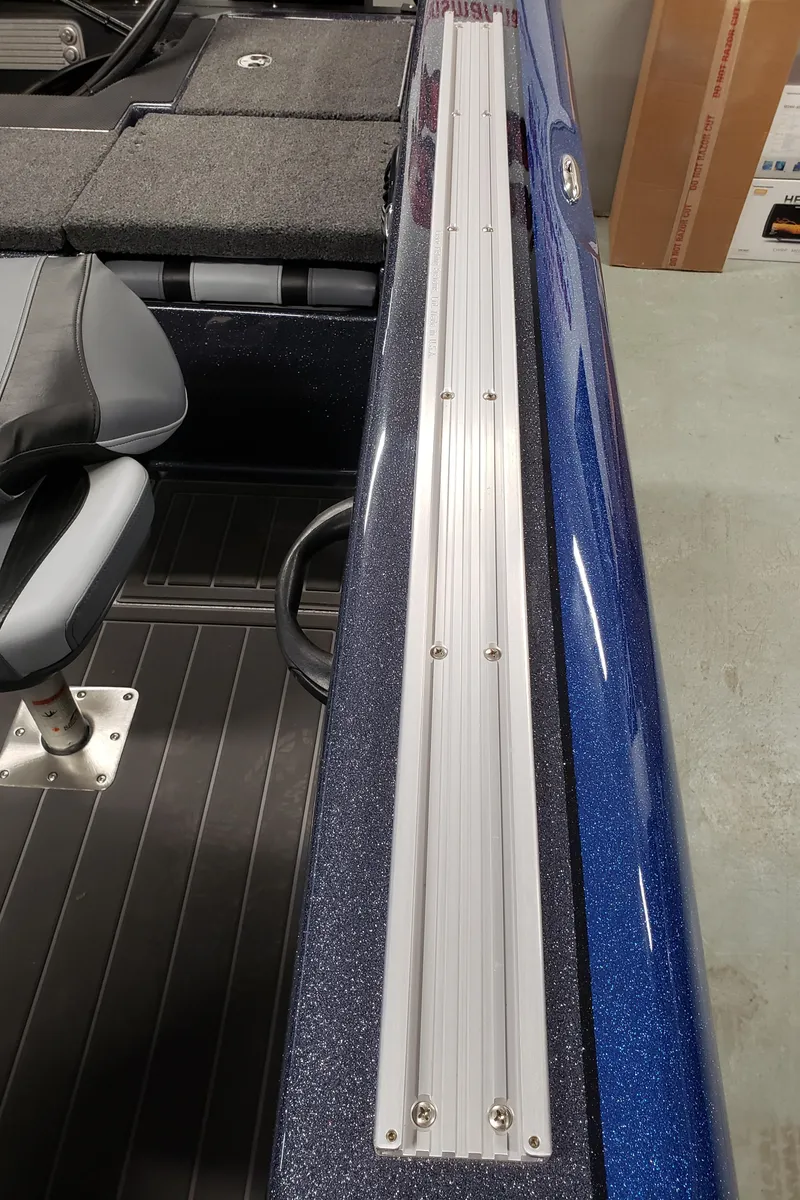 Slide: The Image of 2024 Warrior 208 boat interior with seating and storage compartments. - 12