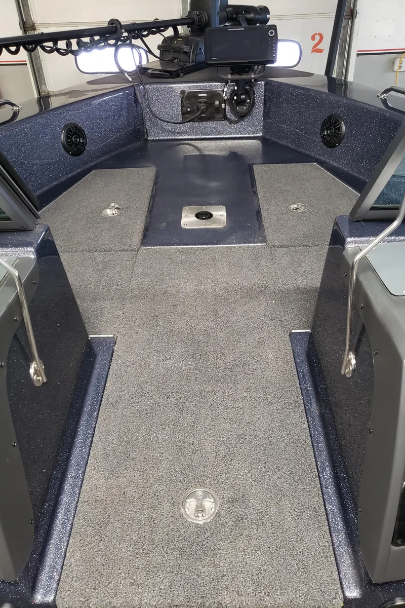 Slide: The Image of 2024 Warrior 208 boat interior with spacious deck and modern equipment. - 15