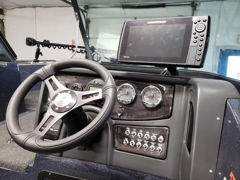 Slide: The Image of Dashboard of 2025 Warrior 208 boat with steering wheel and electronic display. - 5