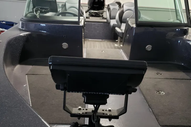 Slide: The Image of 2025 Warrior 208 boat interior with seating and navigation equipment. - 8