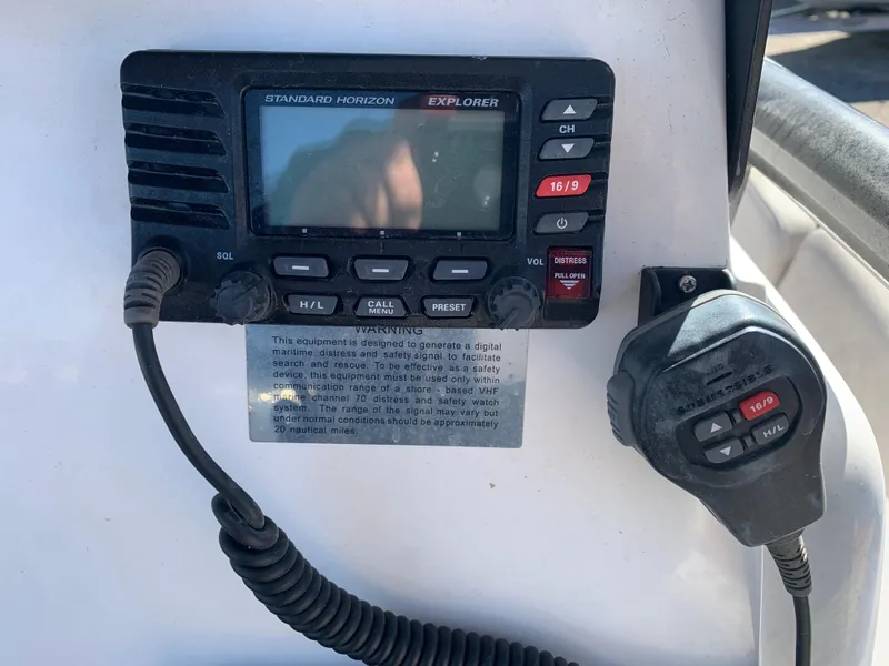 Slide: The Image of VHF radio system on a 2018 Sea Fox 248 Commander boat dashboard. - 12