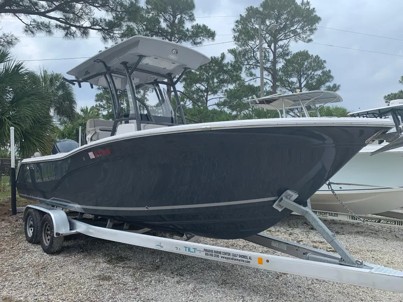 Slide: The Image of 2018 Sea Fox 248 Commander boat on trailer, parked outdoors. - 2
