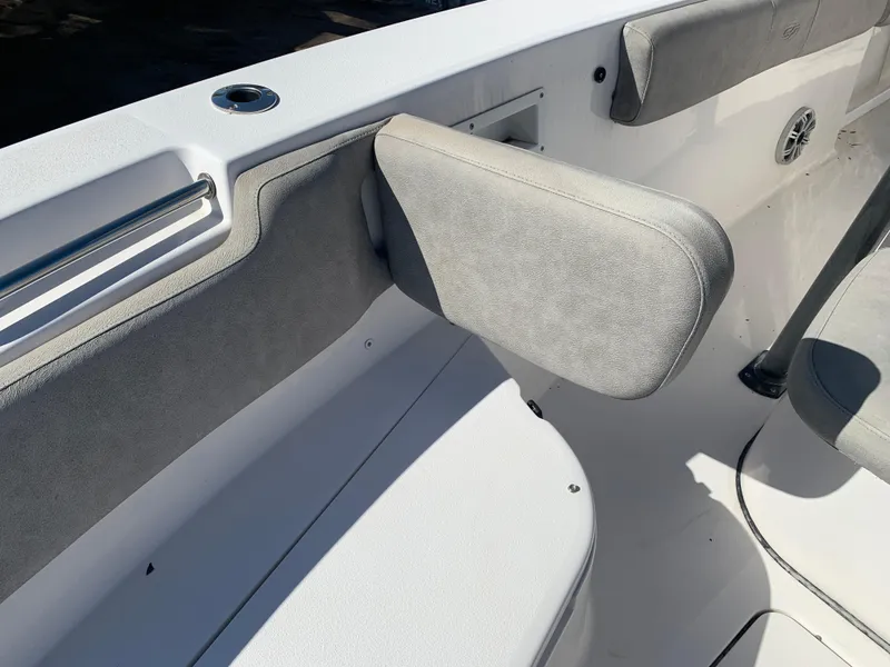 Slide: The Image of 2018 Sea Fox 248 Commander boat interior with cushioned seating and armrest. - 21