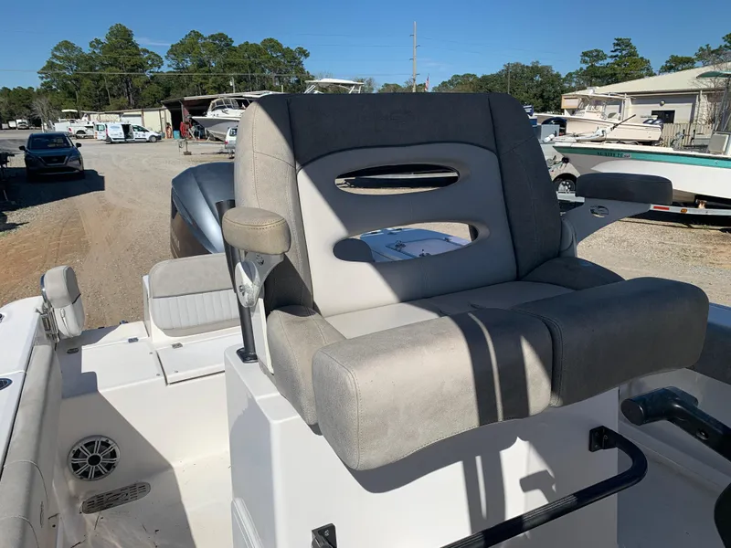 Slide: The Image of 2018 Sea Fox 248 Commander boat seat in a marina setting. - 22