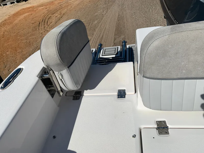 Slide: The Image of 2018 Sea Fox 248 Commander boat seating and deck area, featuring gray cushioned seats. - 23