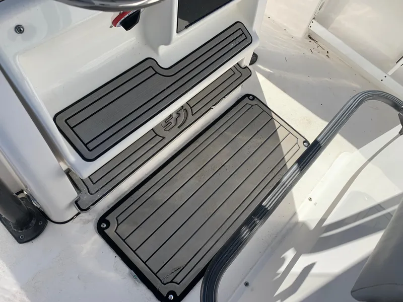 Slide: The Image of 2018 Sea Fox 248 Commander boat deck with non-slip mats and step detail. - 24