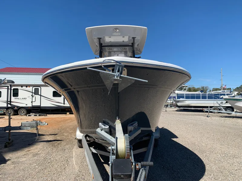 Slide: The Image of 2018 Sea Fox 248 Commander boat on trailer, parked in a lot with other vehicles. - 4