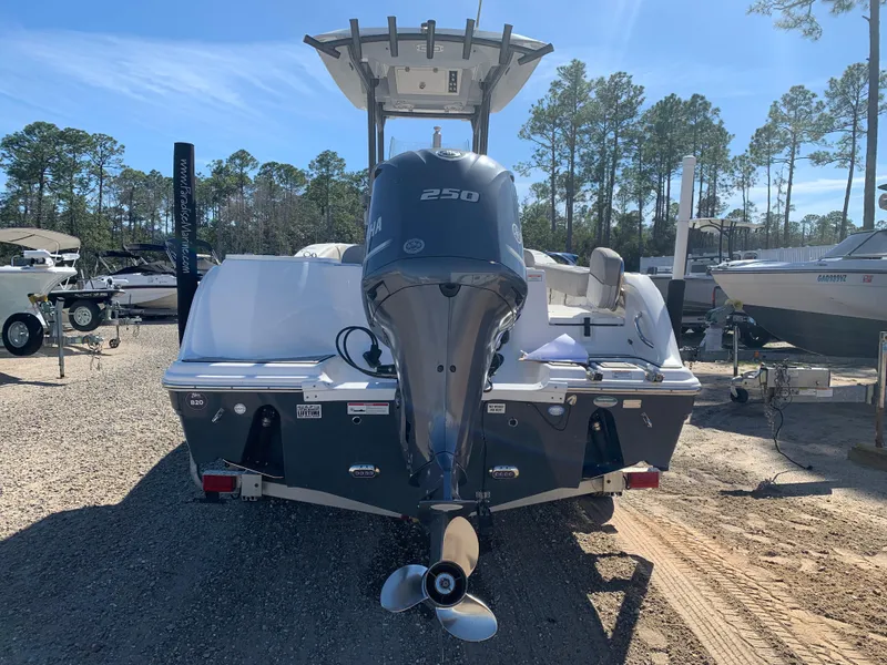 Slide: The Image of 2018 Sea Fox 248 Commander boat with powerful outboard motor, parked on gravel lot. - 7