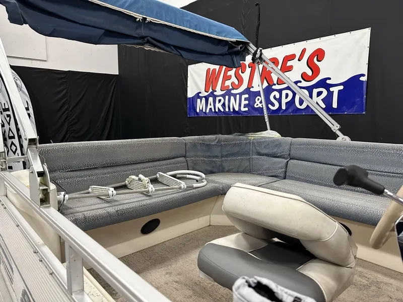 Slide: The Image of 1998 Sylvan Elite 20 pontoon boat interior at Westre's Marine & Sport showroom. - 11