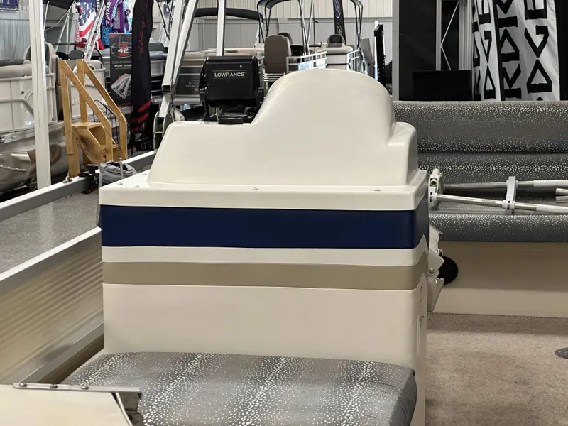 Slide: The Image of 1998 Sylvan Elite 20 boat interior with steering console and seating. - 12