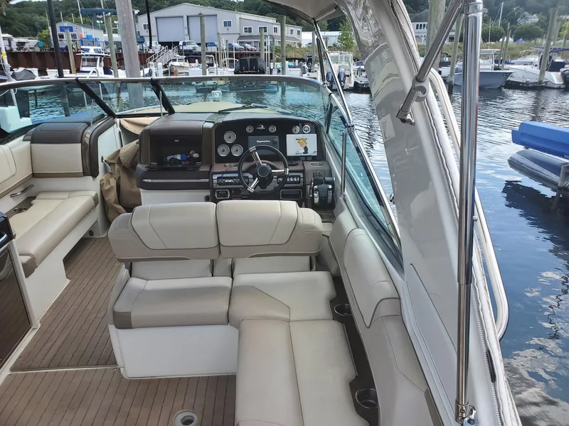 Slide: The Image of 2015 Formula 330 Crossover Bowrider interior with luxurious seating and modern dashboard. - 6