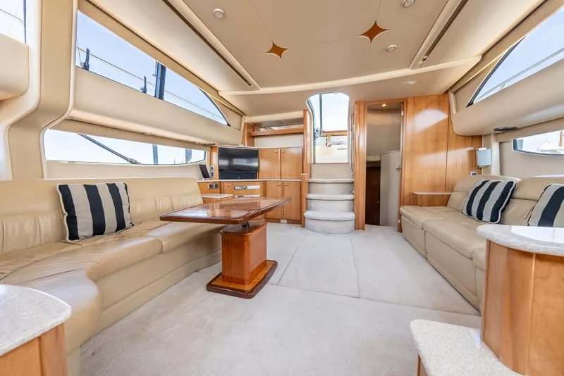 Slide: The Image of Luxurious interior of 2004 Meridian 459 Motor Yacht with plush seating and elegant wood finishes. - 34