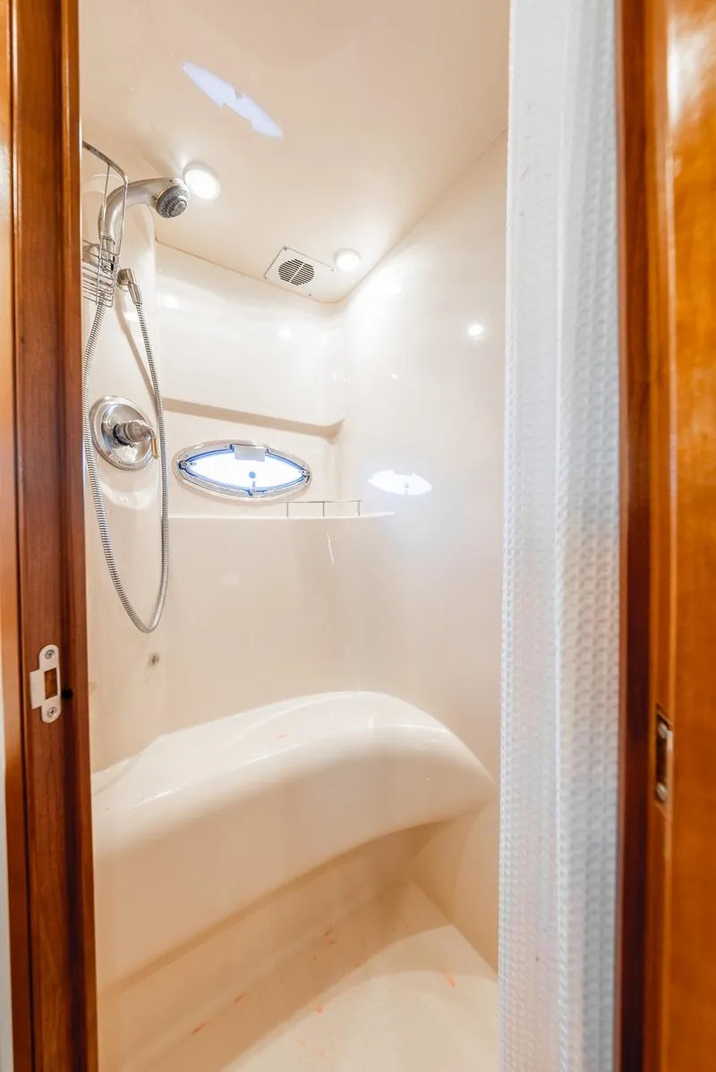 Slide: The Image of Shower area in 2004 Meridian 459 Motor Yacht with modern fixtures and porthole window. - 38