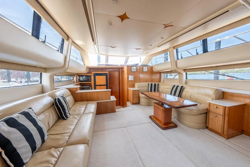 Slide: The Image of Luxurious interior of a 2004 Meridian 459 Motor Yacht with plush seating and elegant design. - 4