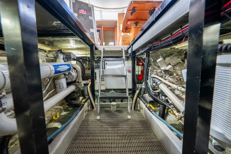 Slide: The Image of Engine room of 2004 Meridian 459 Motor Yacht, showcasing machinery and equipment. - 41