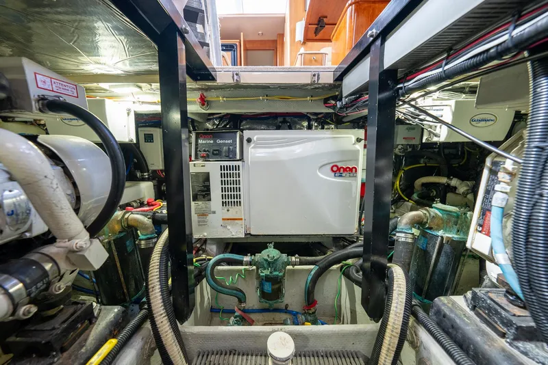 Slide: The Image of Engine room of 2004 Meridian 459 Motor Yacht with Onan generator and mechanical components. - 43