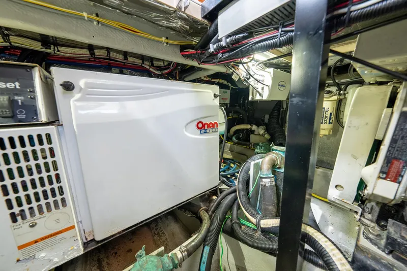 Slide: The Image of Engine room of 2004 Meridian 459 Motor Yacht with Onan generator and wiring. - 45