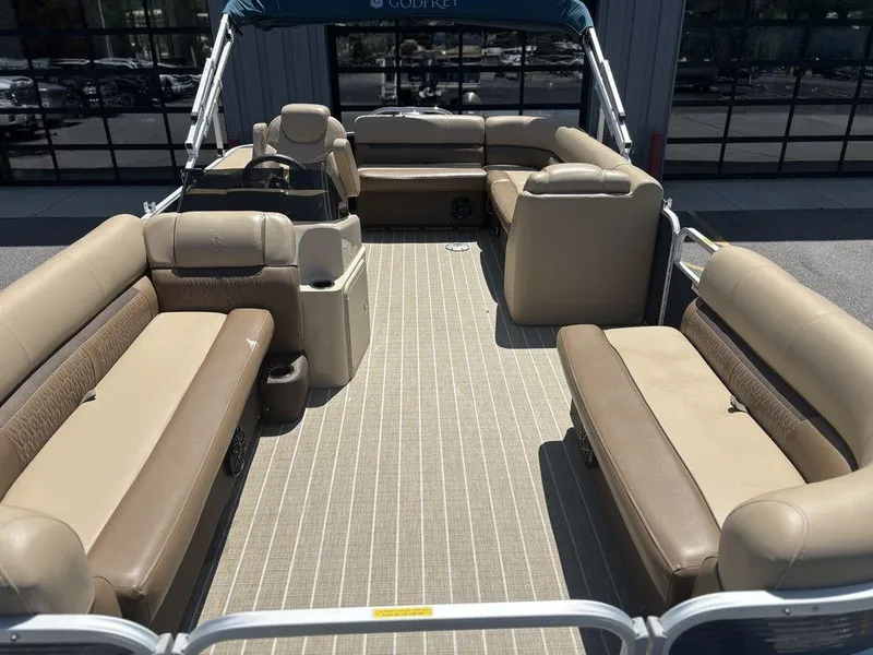 Slide: The Image of 2021 Godfrey SW 2086 C pontoon boat with beige seating and spacious deck. - 14