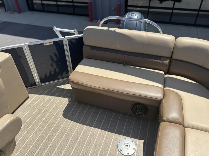 Slide: The Image of 2021 Godfrey SW 2086 C boat interior with beige seating and striped flooring. - 3