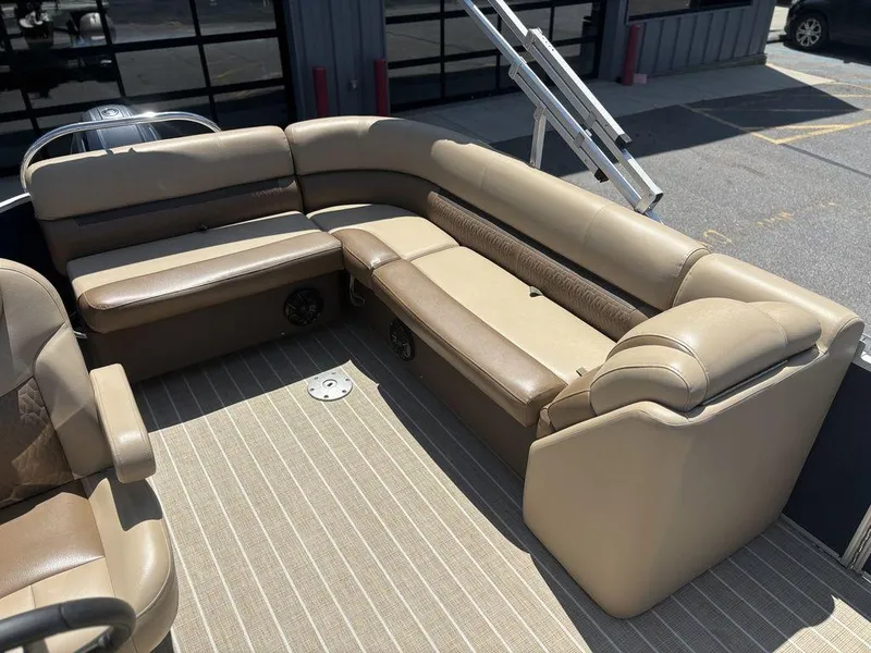 Slide: The Image of Luxurious seating on 2021 Godfrey SW 2086 C pontoon boat, featuring beige upholstery. - 4