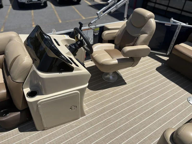 Slide: The Image of 2021 Godfrey SW 2086 C boat interior with beige captain's chair and steering console. - 7
