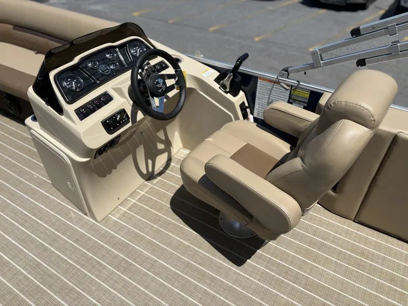 Slide: The Image of Captain's seat and helm of 2021 Godfrey SW 2086 C boat, featuring beige upholstery and controls. - 8