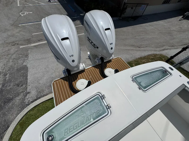 Slide: The Image of 2024 Regulator 31 boat with dual V8 engines, viewed from above. - 2