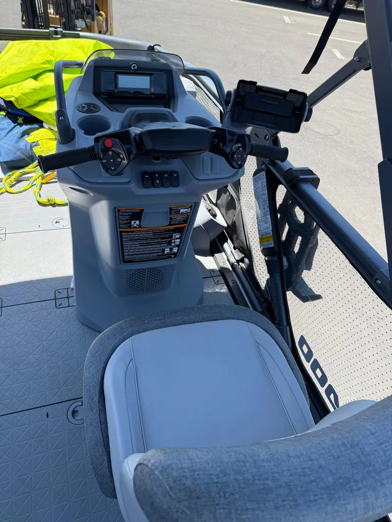 Slide: The Image of 2022 Sea-Doo Switch 18 boat cockpit with steering controls and seating. - 3