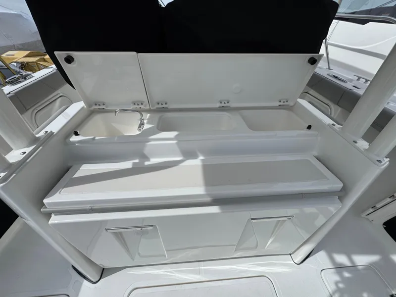 Slide: The Image of 2025 Pursuit S 328 boat interior with storage compartments and sleek design. - 5
