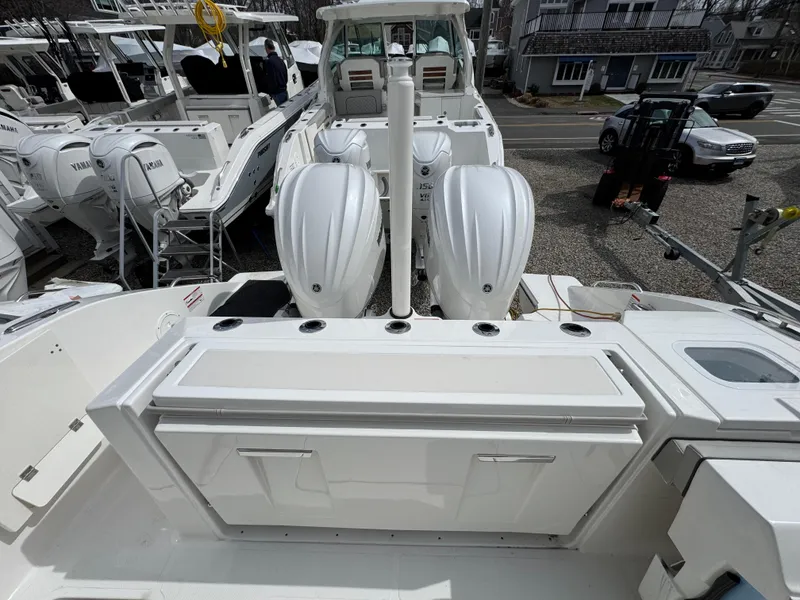 Slide: The Image of 2025 Pursuit S 328 boat with dual engines and spacious deck layout. - 7