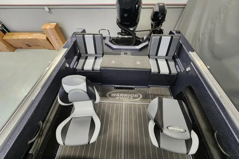 Slide: The Image of 2025 Warrior V238 boat interior with sleek seating and modern design. - 13