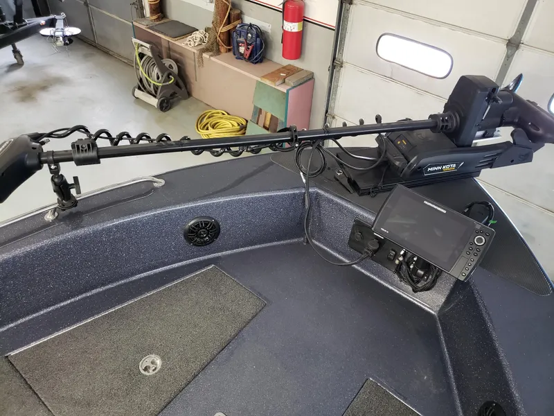 Slide: The Image of 2025 Warrior V238 boat interior with dual seats and modern dashboard design. - 5