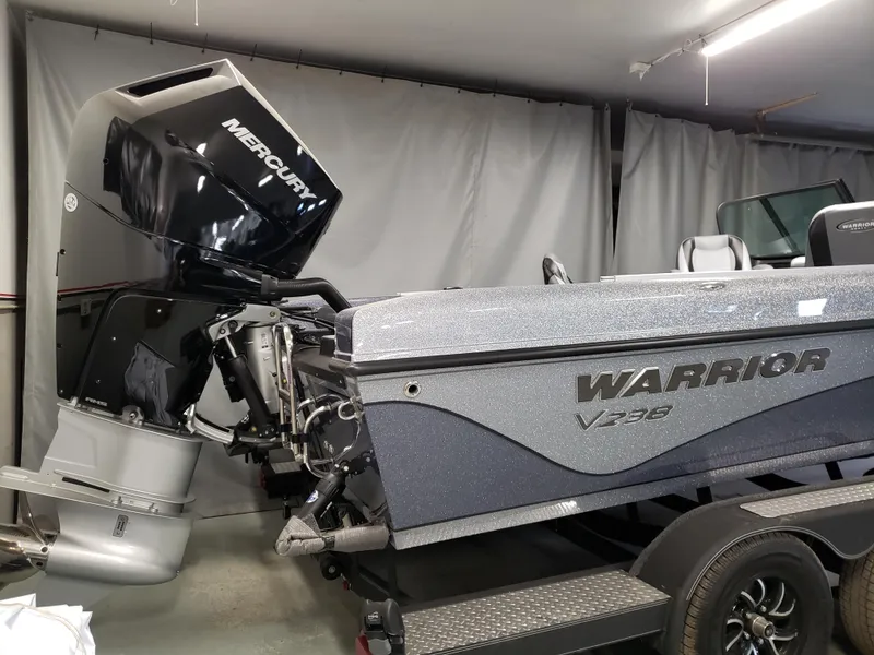 Slide: The Image of 2025 Warrior V238 boat interior with four seats and modern dashboard. - 9